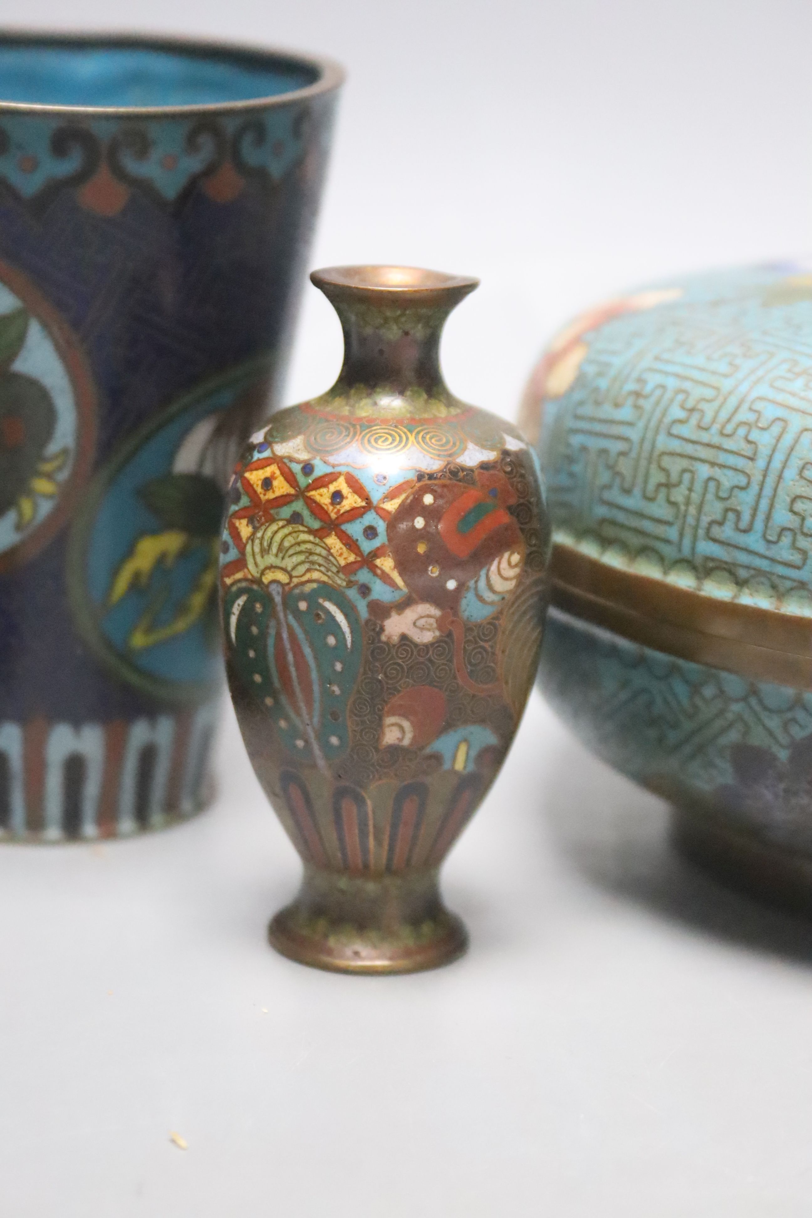 A Chinese cloisonne enamel box & cover, two beakers and four similar Japanese miniature vessels